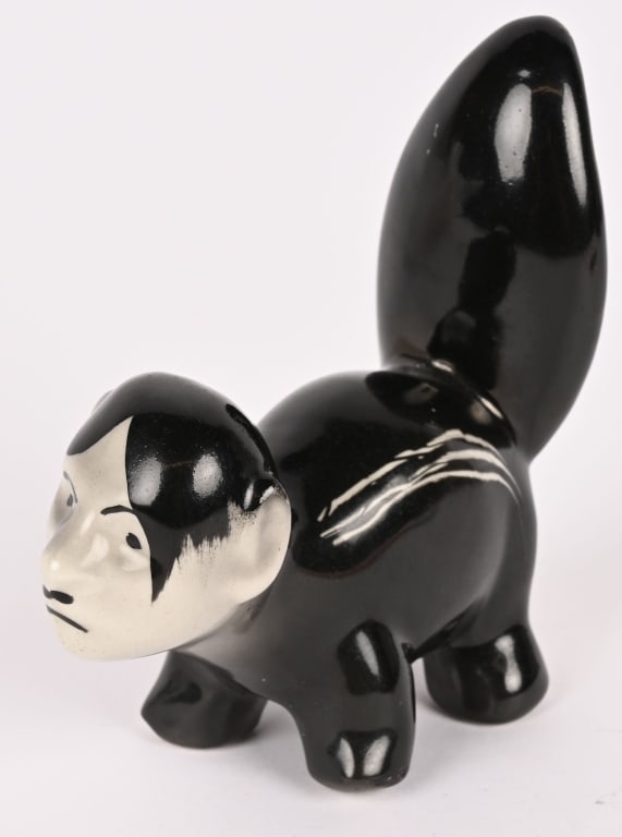 WWII ANTI AXIS HITLER JAPAN'S RISING SUN SKUNK WW2: WWII Anti Axis Home Front 4.75" tall. Glazed pottery skunk with the face of Hitler. Back of the tail has text in gold luster "Japan's Rising Sun." In the same gold luster is a large sun disk over the 
