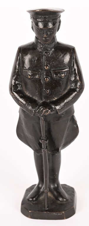 WWII JAPANESE BRONZE OF AN ARMY OFFICER W SWORD: The statue has an overall height of approximately 6 3/4 inches tall, signed on the reverse base. The statue is nicely detailed, with the Japanese Army star visible on the visor cap and the sword tasse