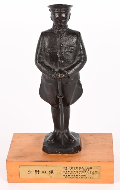 WWII JAPANESE BRONZE OF AN ARMY OFFICER W SWORD: The statue has an overall height of approximately 6 3/4 inches tall, signed on the reverse base. The statue is nicely detailed, with the Japanese Army star visible on the visor cap and the sword tasse