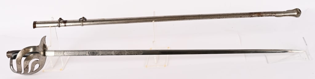 WWII ITALIAN ARMY OFFICERS SWORD WITH SCABBARD: Sword features a 37 1/2" etched blade and includes scabbard. Overall length is 45 1/4" and appears to be in near mint condition. Blade is in excellent condition and is also maker marked Clement & Jung