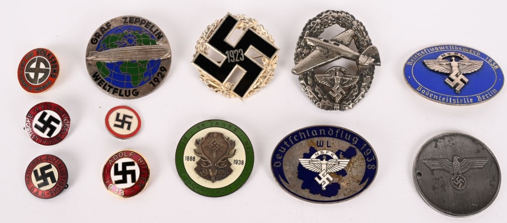 WWII NAZI GERMAN NSFK GAU BADGE LOT NSDAP POLICE: Lot of reprop items to include 1) NSFK Reichsflugwettbewerh 1938 Badenleitstelle Berlin Badge 2) Deutschlandflug 1938 NSFK Badge 3) NSFK Motor Pilot’s Badge, Type II 4) Graf Zeppelin Weltflug 19