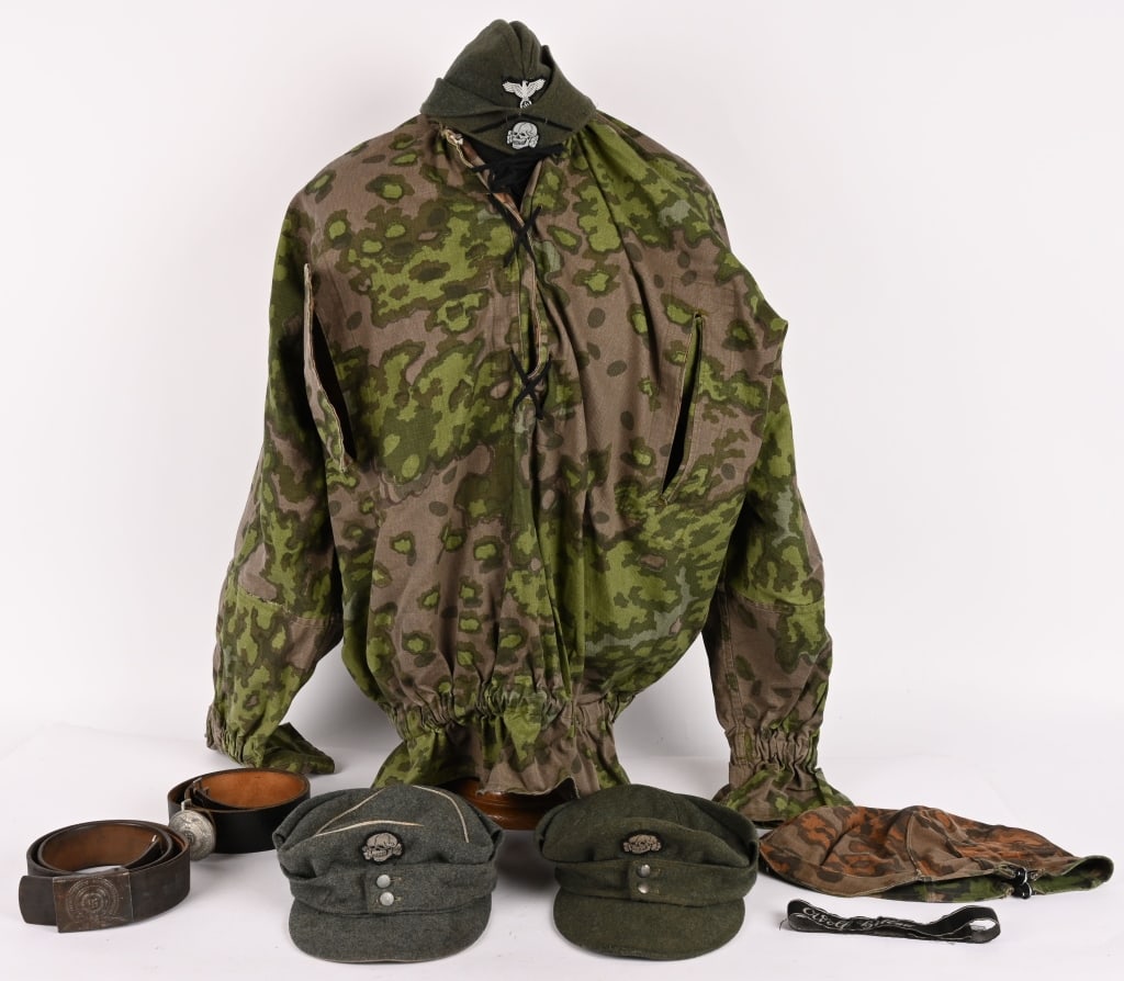 WWII NAZI GERMAN REPO WAFFEN SS SMOCK & CAPS LOT: Lot of Repo items to include 1) Waffen SS M43 Officer's Cap size 57. 2) Enlisted SS Mountain M43 Cap marked to the interior SS BKW V 58 3) SS Enlisted Overseas Cap with a black soutache 4) SS Camo Hel