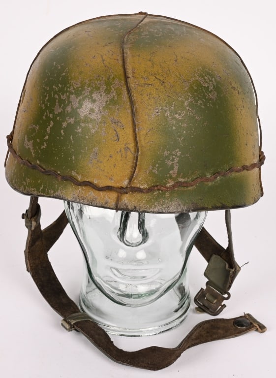 WWI REPO NAZI GERMAN PARATROOPER HELMET W LINER: This repop WWII Nazi German M38 camo paratrooper helmet with liner and chinstrap. This helmet is completely is excellent for display at a fraction of the cost of an original. Excellent.