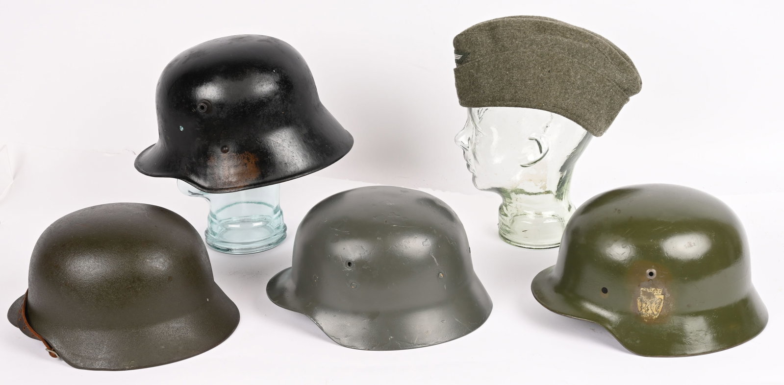 WW1 WWII POST IMPERIAL AUSTRIAN GERMAN HELMET LOT: Lot of Military Headgear to include 1) IMPERIAL AUSTRIAN PARTIAL CAMO HELMET SHELL. Shell is marked AW64 indicating the maker A. Westen Cilli: Located in Celje, Slovenia with a black over-paint of a