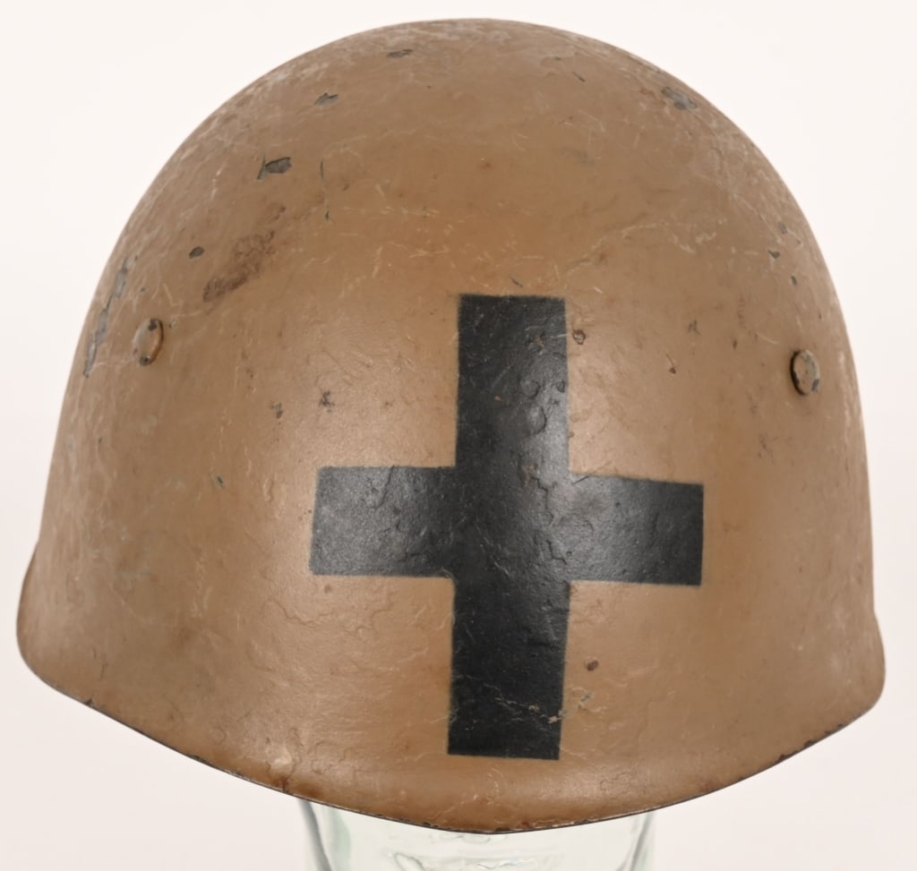 WWII ITALIAN UNIT MARKED HELMET W LINER CHINSTRAP: Helmet model 33 with Black Cross unit insignia to the front in 90% light tan tropical color, beautiful condition complete in all its parts with patina of time excellent internal liner and chinstrap no
