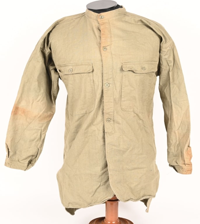 WWII IMPERIAL JAPANESE LONG SLEEVE ISSUE SHIRT WW2: Khaki-colored cotton, long-sleeved shirt has a four button single-breasted front closure. Patch pockets are to each breast, each with a buttonholed, straight flap mating with a mottled bakelite button