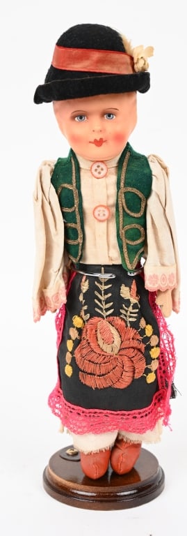 WWII NAZI GERMAN LADIES DOLL WW2: A German composition doll, German 1930s, with painted blue eyes, mouth and short brown hair, swivel head to cloth body and jointed at shoulders and hips and wearing traditional German Ladies attire,12