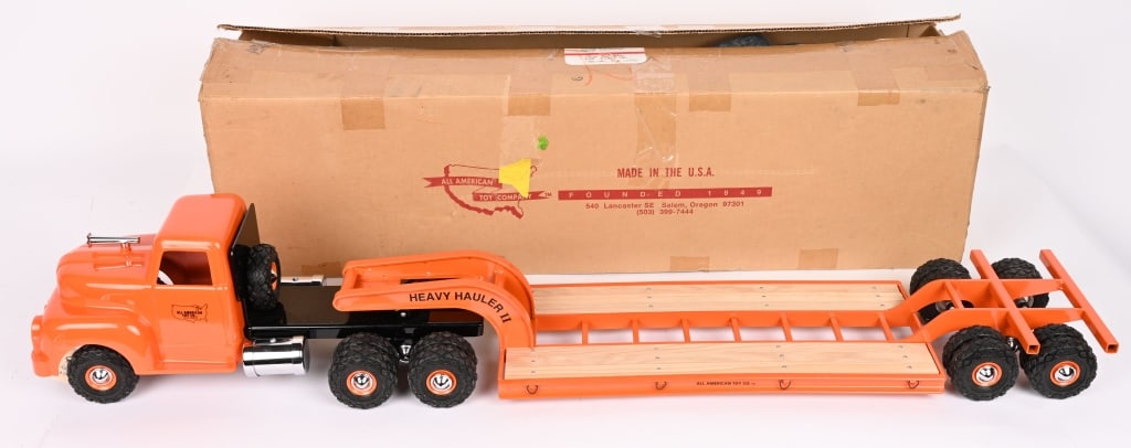 ALL AMERICAN TOYS LOW BOY TRACTOR TRAILER w/ BOX: Wonderful limited edition #16 of 225 units made. Never played with condition. Very detailed with wood decking on the trailer. Large an impressive truck. With Box. 36" Near Mint Provenance: Tar Heel To