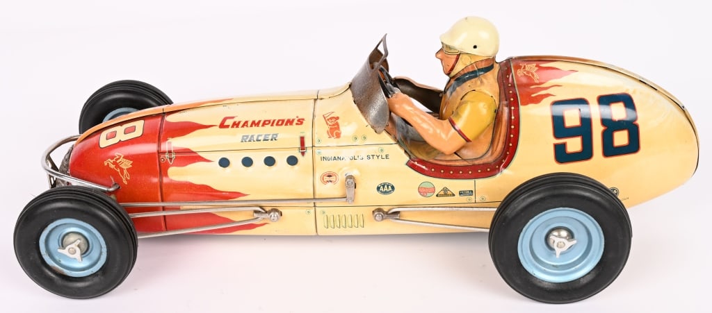 SANYO TIN FRICTION #98 CHAMPION'S RACER: Outstanding original #98 Racer. Still has very nice colors. Very clean condition. Underside is clean with button still over the tabs. Friction works. Has $200 correct replacement tires. A very nice ex