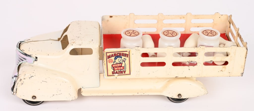 MARX MARCREST DAIRY TRUCK: Nice early Marx Milk Truck. Has original paint and decals. Comes with accessory Milk Bottles. Grill correct replacement. 14" Provenance: Tar Heel Toys the Dennis Sapp Collection