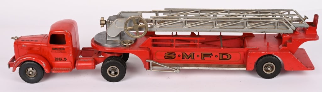 SMITH MILLER LADDER TRUCK: Nice original paint and decals. Broken bumper and missing a few minor pieces. Displays great. 36" Very Good-Excellent Provenance: Tar Heel Toys the Dennis Sapp Collection