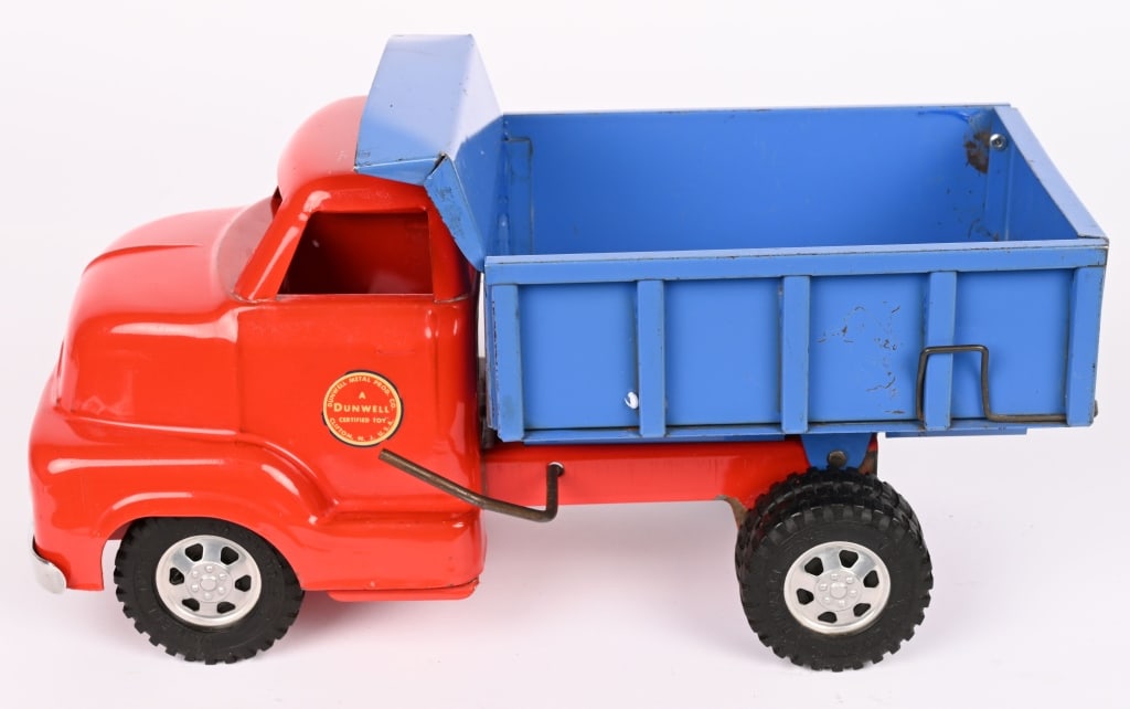 DUNWELL PRESSED STEEL DUMP TRUCK: Wonderful original condition. Very nice paint and decals. 13" Excellent Provenance: Tar Heel Toys the Dennis Sapp Collection
