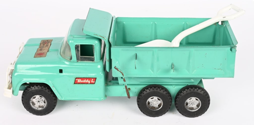 BUDDY L HEAVY DUTY DUMP TRUCK: Nice original condition. Still has Spring Sticker on hood. Missing plastic mirror. Comes with shovel. 14" Excellent Provenance: Tar Heel Toys the Dennis Sapp Collection