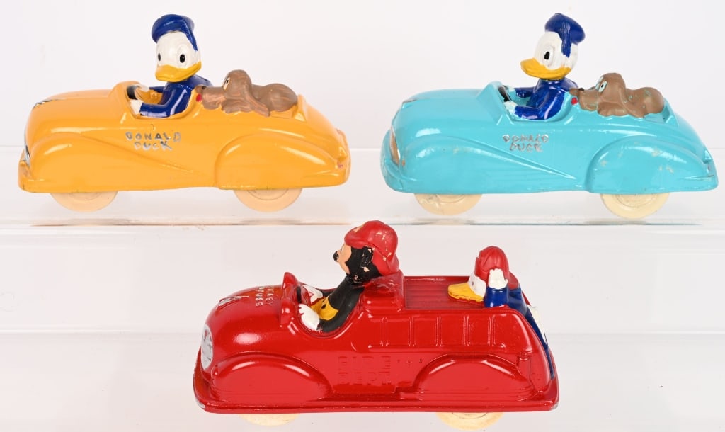 3- SUN RUBBER DISNEY CARS: Includes 2 Donald Duck cars and Mickey Mouse Fire Truck. All restored condition. 6" Excellent Provenance: Tar Heel Toys the Dennis Sapp Collection