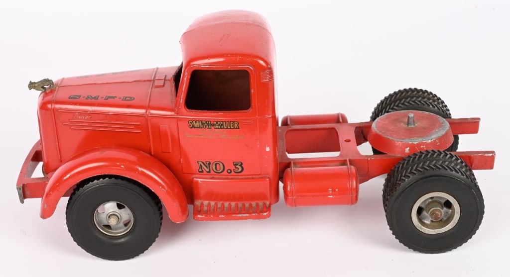SMITH MILLER B MACK SMFD CAB: All original condition. Front bumper broke and missing headlights. Nice paint and decals. 15" AS-IS Provenance: Tar Heel Toys the Dennis Sapp Collection