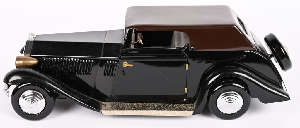 ROLLS ROYCE MUSIC BOX: Very nice pressed steel Rolls Royce Music Box. Well made. Music box works. Nice toy. 16" Excellent Provenance: Tar Heel Toys the Dennis Sapp Collection
