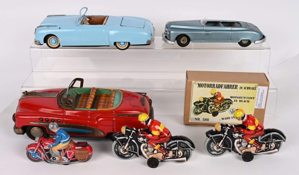 LOT OF TOYS: Includes Japan tin car, German toy cars, and modern motorcycles. Conditions vary. Largest 11" AS-IS Provenance: Tar Heel Toys the Dennis Sapp Collection