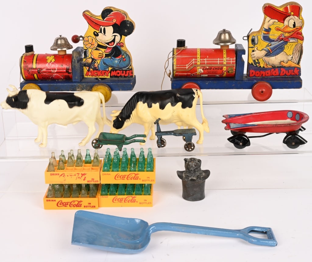 LOT OF VINTAGE TOYS: includes Mickey Mouse and Donald Duck Fisher Price Locomotives, Flash strato wagon, Iron Toys, Plastic Cow, Coca Cola Crates, and More. Conditions vary. Largest 10" AS-IS Provenance: Tar Heel Toys