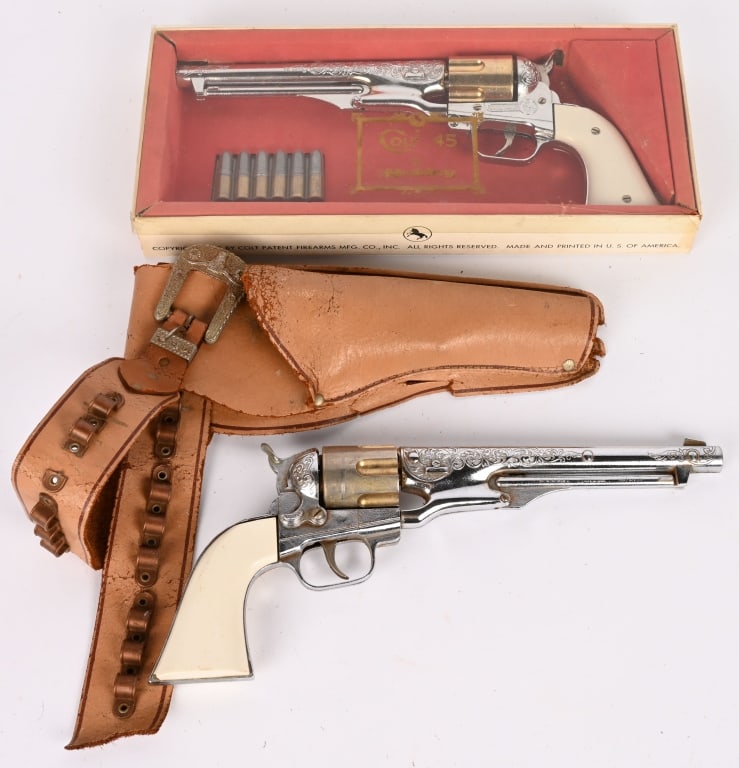 2- CAP GUNS: Includes Hubley Colt 45 with Box and Hubley Colt 45 with Holster. Holster has wear and broken. 14" Excellent Provenance: Tar Heel Toys the Dennis Sapp Collection