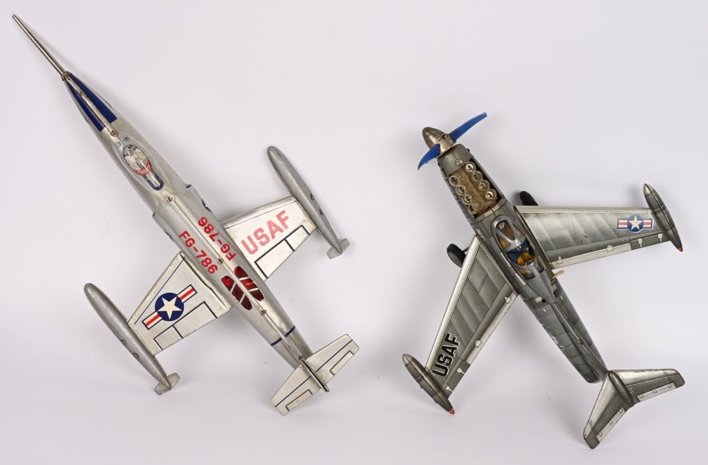 2- JAPAN TIN FIGHTER PLANES: Includes tin friction FG-786 and battery operated FS-059 not working. Both in nice original condition. 18" Excellent