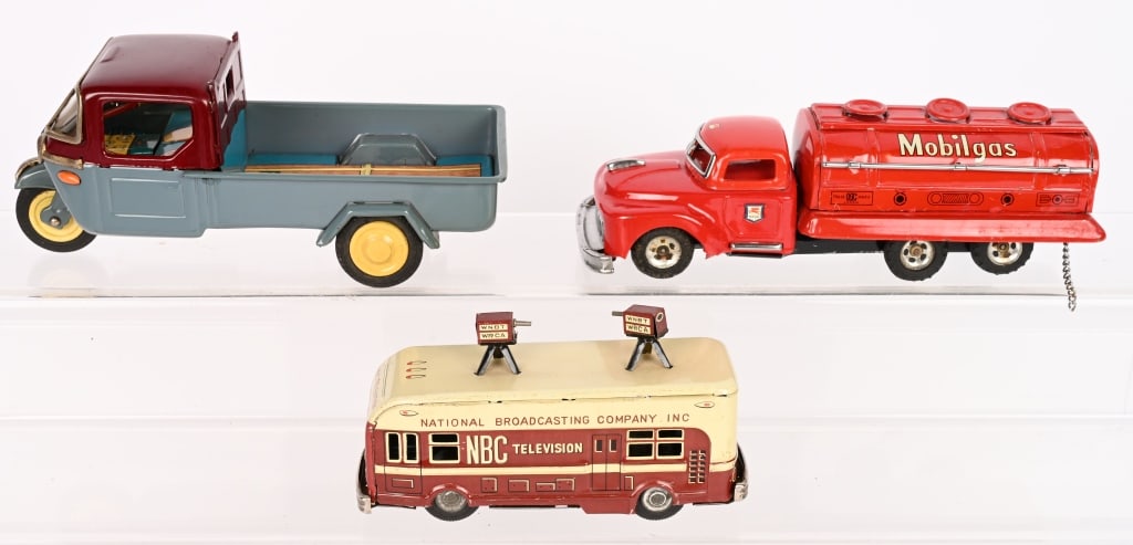 3- JAPAN TIN FRICTION VEHICLES: Includes NBC Television Van, Mobilgas Tank Truck, and Mazda 3 Wheel truck. All frictions work. Very nice condition. Largest 8" Excellent