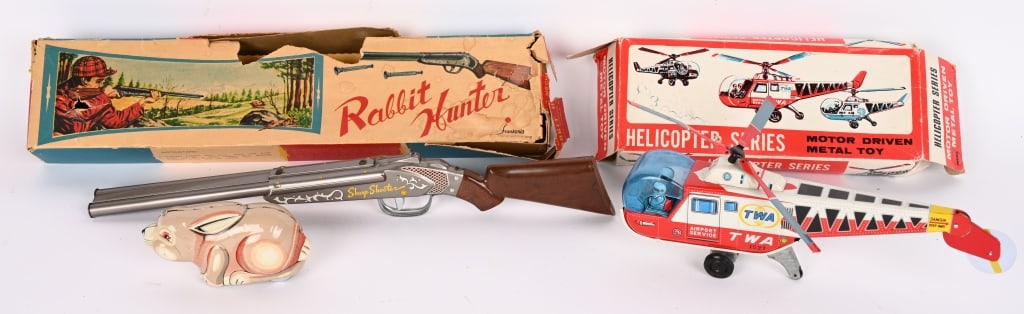 JAPAN TWA HELICOPTER & RABBIT HUNTER: Includes tin friction TWA Helicopter with Box. Plus Japan Rabbit Hunter Set complete with Rabbit and Gun Boxed. Both in great shape. Largest 19" Excellent