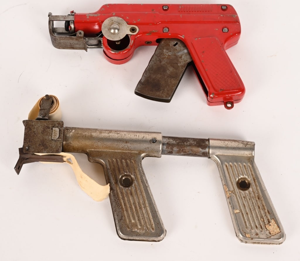 2- FUTURISTIC METAL PAPER PISTOLS: Lot of 2 vintage futuristic space type paper pistols. Not working. Largest is 7 1/2" very Good