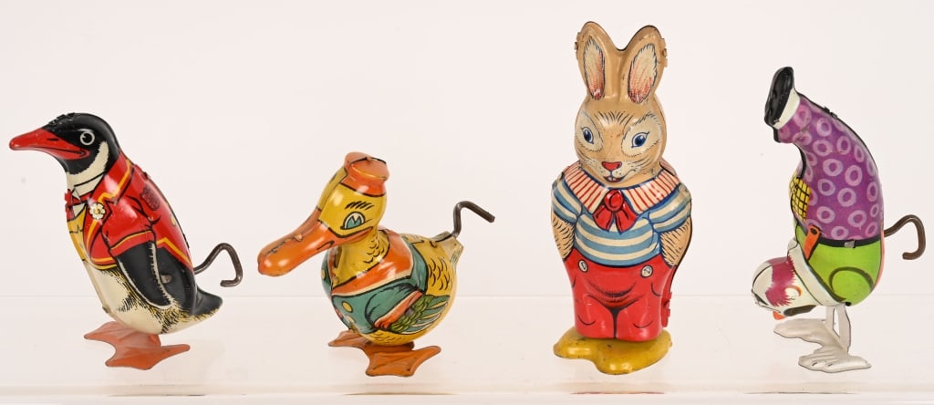 4- CHEIN TIN WINDUP TOYS: Includes Clown, Rabbit, Penguin, and Duck. All original and work. Largest 5" Excellent
