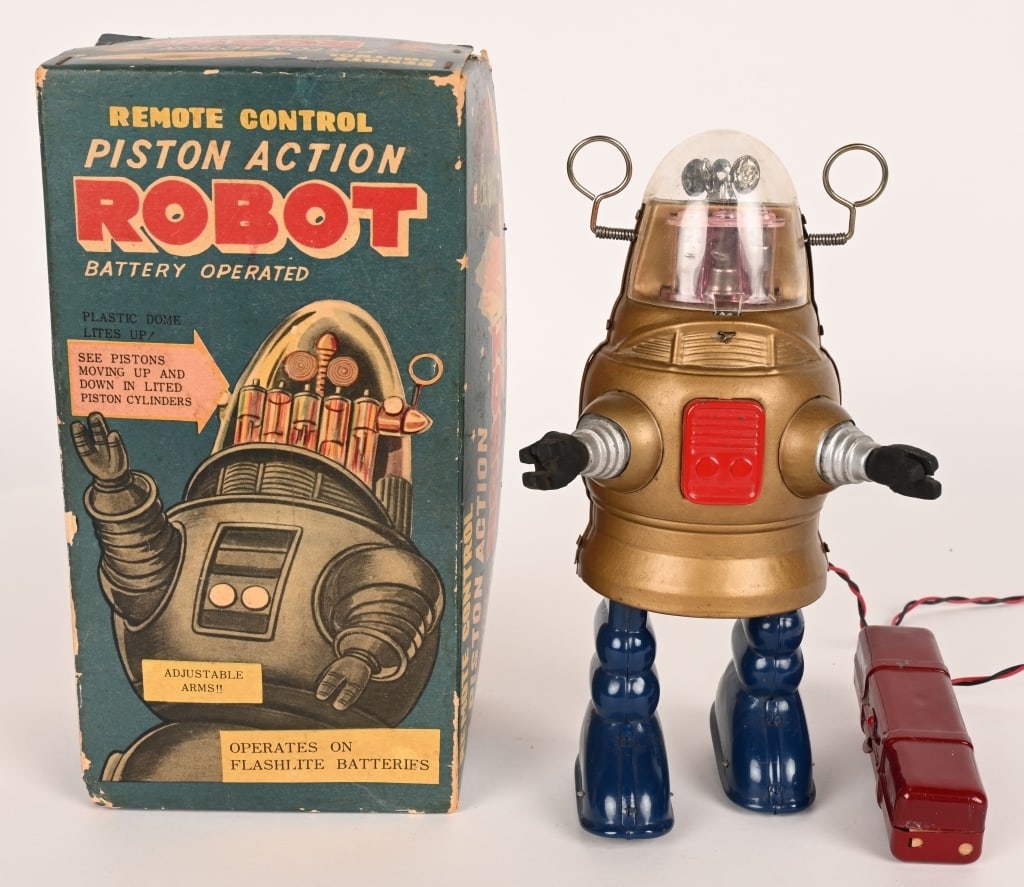 SHOWA BATTERY OP PISTON ROBOT w/ BOX: Japan battery operated Piston Robot. All original in great condition. Has correct battery box remote control. Lights up but did not operate when tested. With nice Box and Insert. 9" Excellent