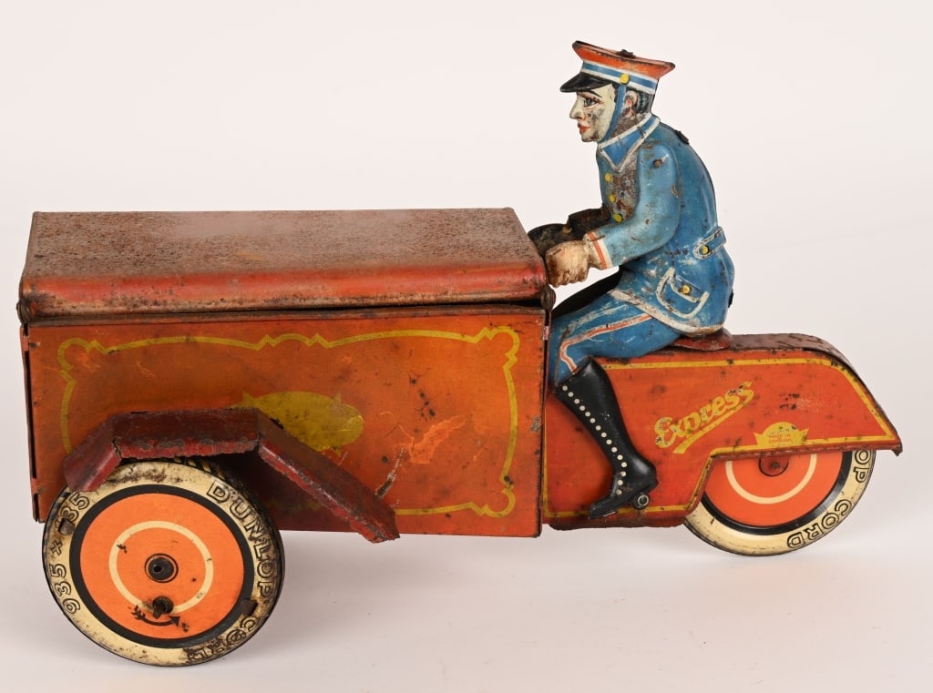SAALHEIMER & STRAUSS TIN DELIVERY MOTORCYCLE: RARE German tin Delivery Motorcycle. All original condition. Has opening box in front. Large impressive toy. Marked made in Germany on side. A very rare motorcycle toy. 11" Very Good