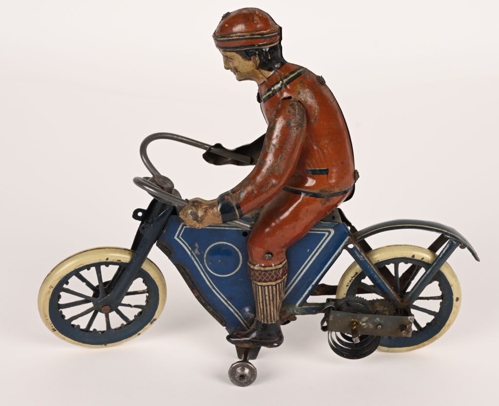 DISTLER TIN WINDUP MAN ON EARLY MOTORCYCLE (1 of 5)