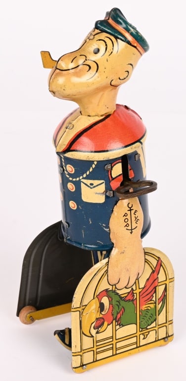 MARX TIN WINDUP POPEYE w/ PARROT CAGES: Popeye with Parrot Cages. Has strong bright colors. Has original pipe. Windup works. 8 1/2" Excellent