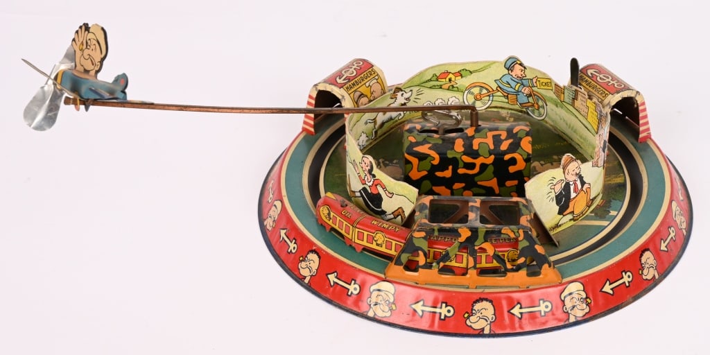 MARX TIN WINDUP POPEYE EXPRESS: Marx tin windup Popeye Express. Nice looking Popeye toy with nice colors and graphics. Still has original cardboard insert with graphics. Windup works. Toy displays great. The propeller on the Popeye 
