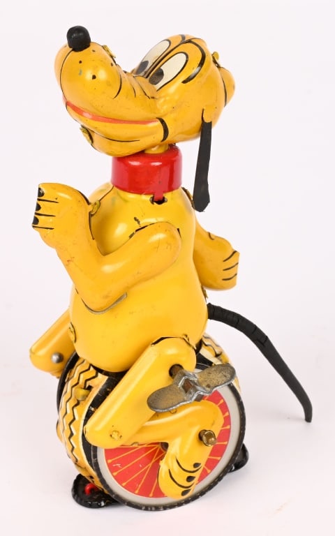 LINEMAR TIN WINDUP PLUTO UNICYCLE: All original in great shape. Has original tail but ears look to be replaced. Windup works. 5 1/2" Excellent