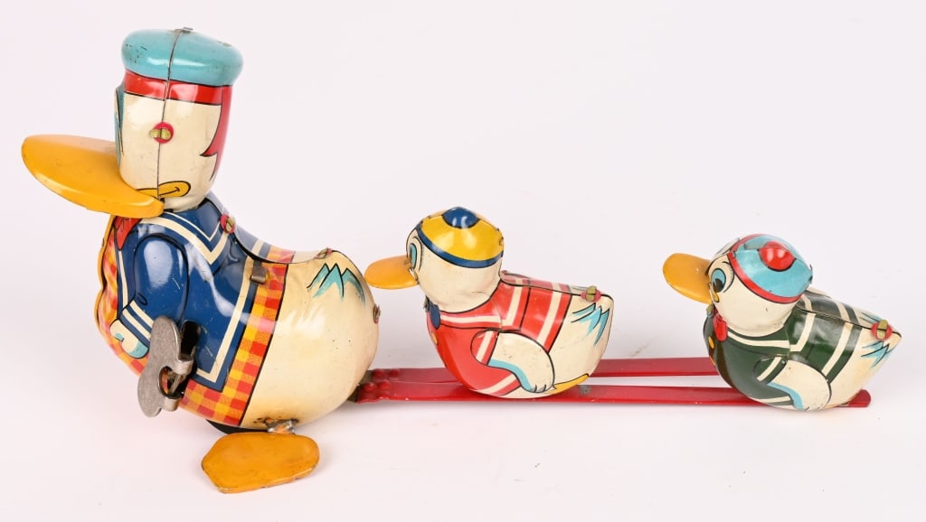 JAPAN TIN WINDUP DONALD DUCK & NEPHEWS: All original with great colors. Windup works. Scarce toy. Made by DAITO. 8" Excellent