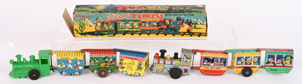 2-MARX TIN WINDUP DISNEY EXPRESS TRAINS: All original in great shape with nice graphics. Windup works. Comes With original colorful Box. 12" Excellent. Also a Casey Jr. Disney Land Express. Windup works. Excellent.
