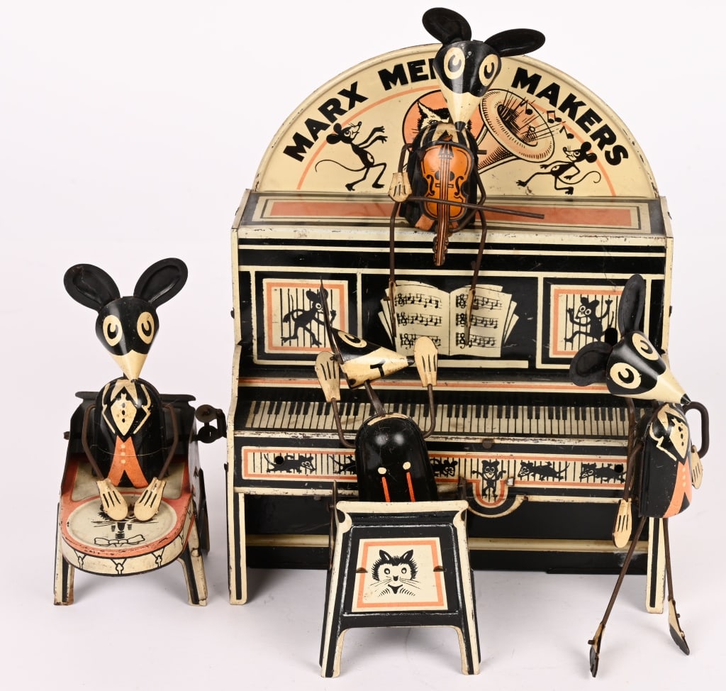 MARX TIN WINDUP MERRY MAKERS BAND: Marx Merry Makers band deluxe version with marquee and violin player. All original and worked when tested. Has some wear. 9 1/2" by 8" Excellent