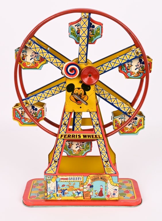 CHEIN TIN WINDUP MICKEY MOUSE FERRIS WHEEL: The toy has nice graphics of Mickey Mouse and other Disney characters. The windup works. Very nice colors with some wear. 17" Excellent
