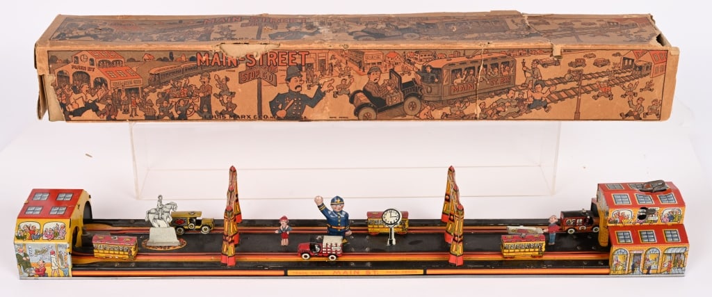 MARX TIN WINDUP MAIN STREET w/ BOX: Marx tin windup Main Street. All original with great colors and graphics. All complete. Windup works. Comes with Original Box and great graphics. Box is in good conditions there is some tear and it