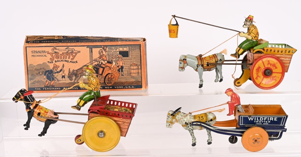 3- STRAUSS TIN WINDUP WAGON TOYS: Lot includes Strauss no 35 Wildfire Trotter tin windup. Windup works. Also 2 different Strauss mechanical Jenny The Balking Mule. Both windups work. Lot comes with an original box for the Jenny The