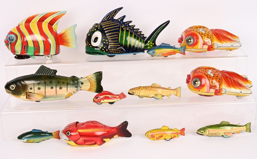 14- JAPAN TIN FRICTION & WINDUP FISH: Lot of colorful tin friction Fish. All work except one of the small friction fish. Largest 9-1/2" Very Good-Excellent
