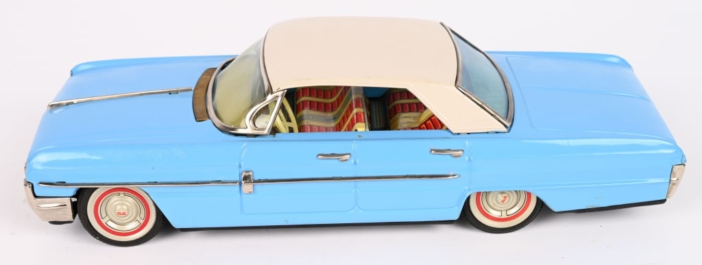 JAPAN TIN FRICTION 1964 OLDSMOBILE SEDAN: All original in great condition. Friction works. 11" Excellent