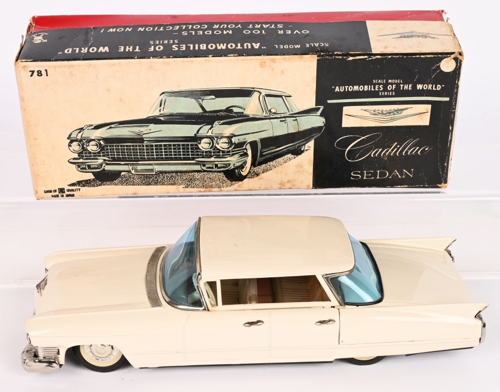 BANDAI TIN RICTION 1960 CADILLAC SEDAN w/ BOX: All original and looks never played with. friction works. Boxed 11 1/2" Excellent
