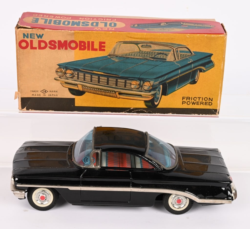 JAPAN TIN FRICTION NEW OLDSMOBILE w/ BOX: All original and in great condition. Friction works. Boxed 9" Excellent