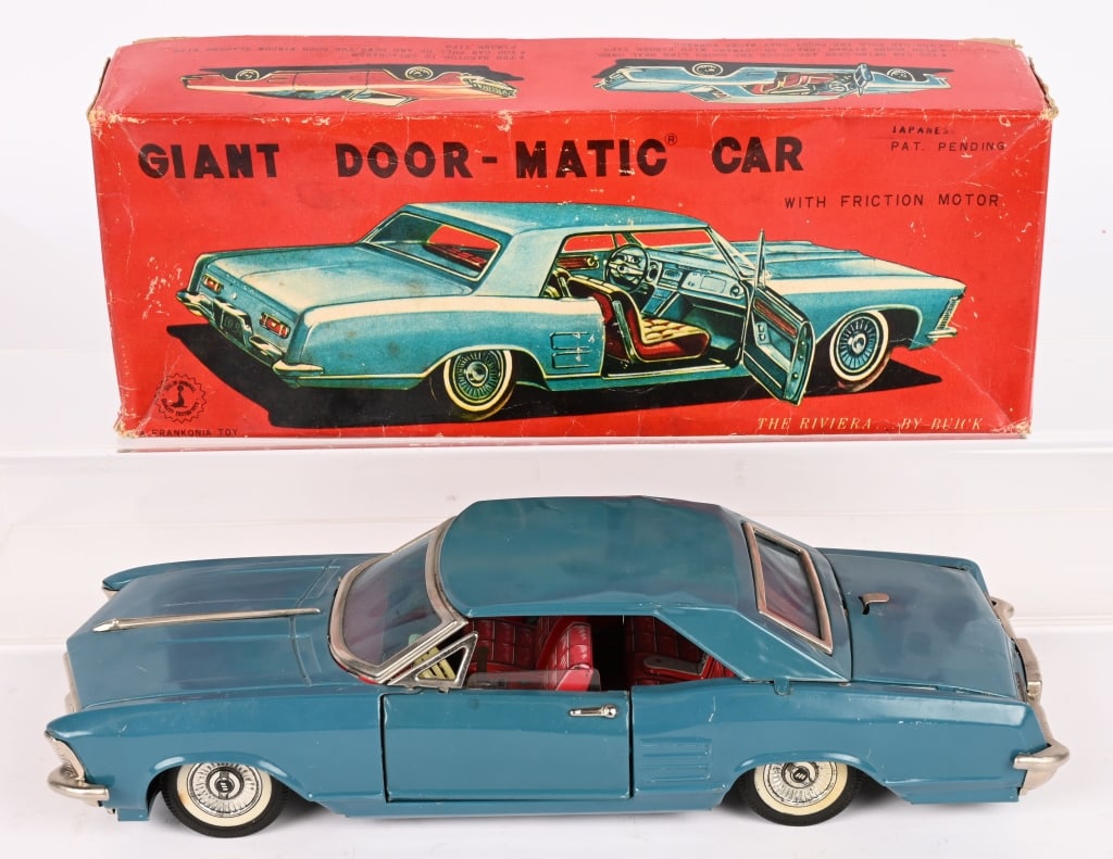 HAJI TIN FRICTION 1964 BUICK DOOR-MATIC CAR w/BOX: Nice looking Buick with opening doors and truck. All original in great shape. Friction works. Boxed 11" Excellent