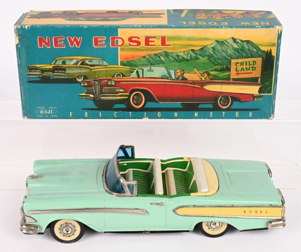 HAJI TIN FRICTION 1958 EDSEL CONVERTIBLE: Very desirable tin car. All original in great condition. Has very nice colors. Friction works. Comes with reproduction Box. 11" Excellent