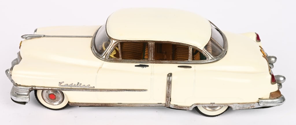 MARUSAN TIN FRICTION 1954 CADILLAC SEDAN: Wonderful all original 1954 Cadillac tin friction Car. Great details. Friction working. 12" Excellent