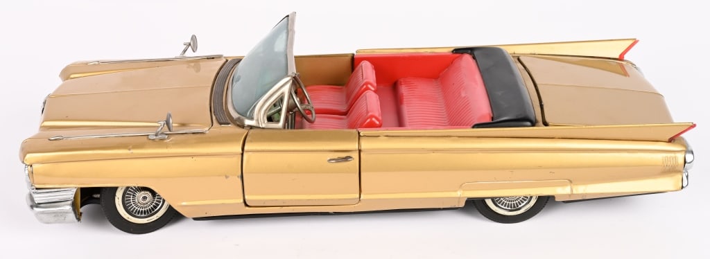 BANDAI BATTERY OP 1961 CADILLAC CONVERTIBLE: Large impressive Cadillac Convertible. All original condition. Very clean. Did not work when tested. Trunk has replaced tabs. Nice looking car. 17" Excellent