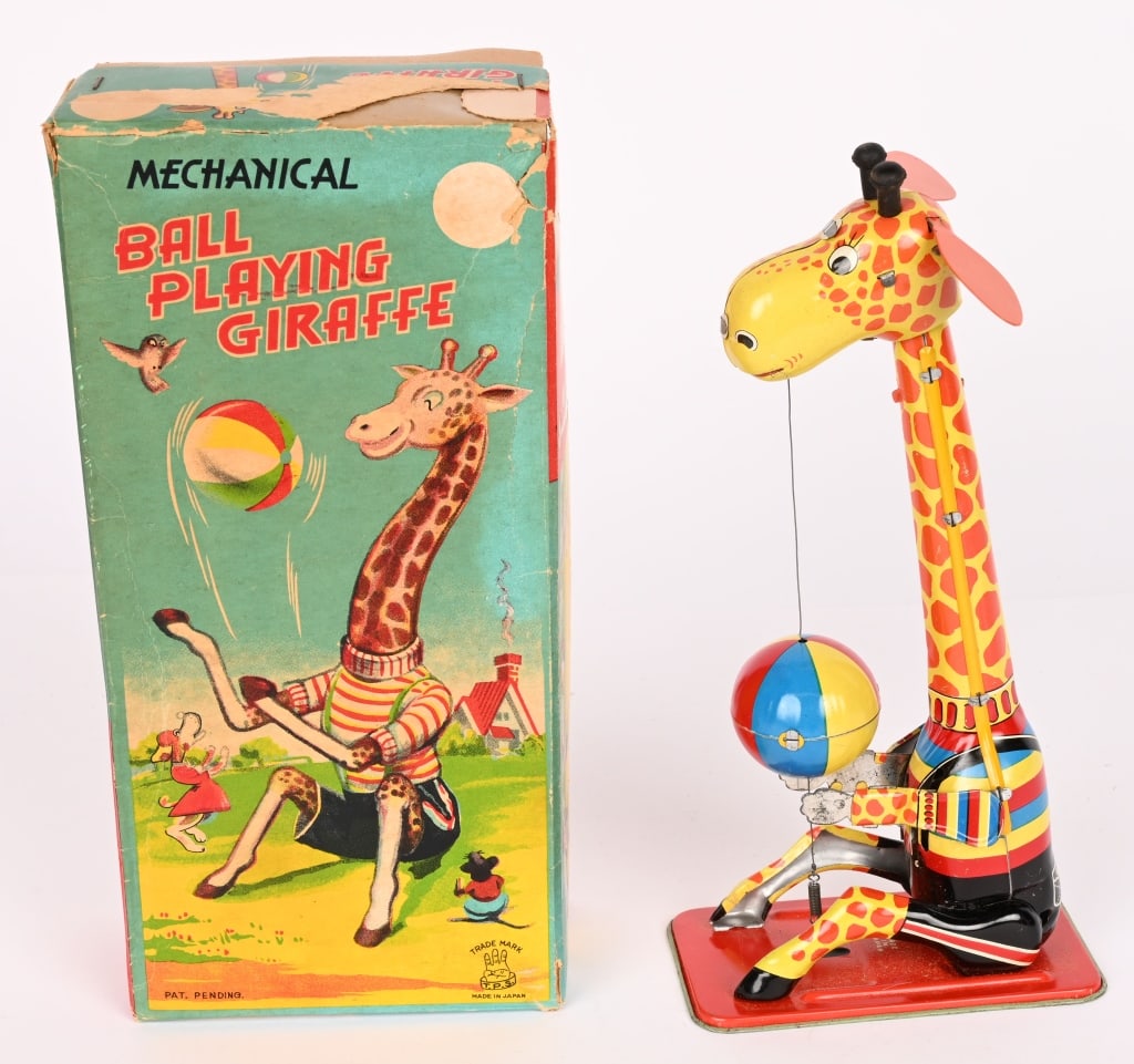 TPS TIN WINDUP BALL PLAYING GIRAFFE w/ BOX: All original and looks never played with condition. Windup works. Boxed 9" Excellent