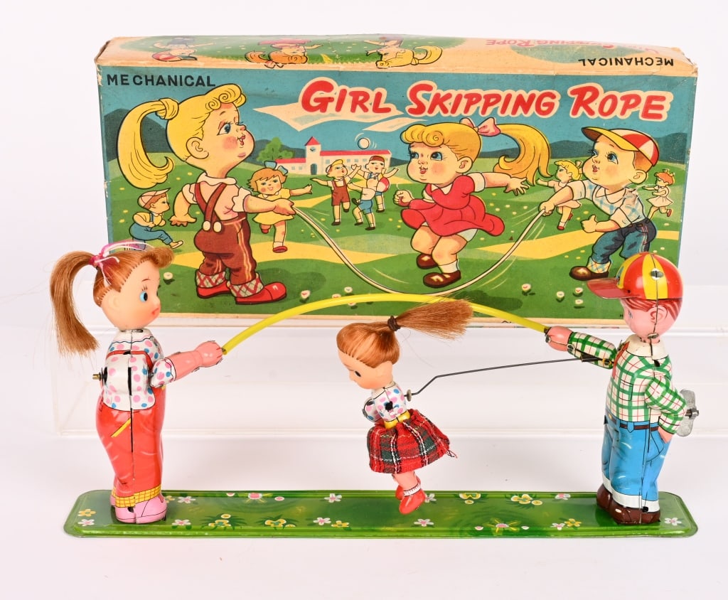 TPS TIN WINDUP GIRLS SKIPPING ROPE w/ BOX: All original and looks never played with. Works. Boxed 12 1/2" Excellent